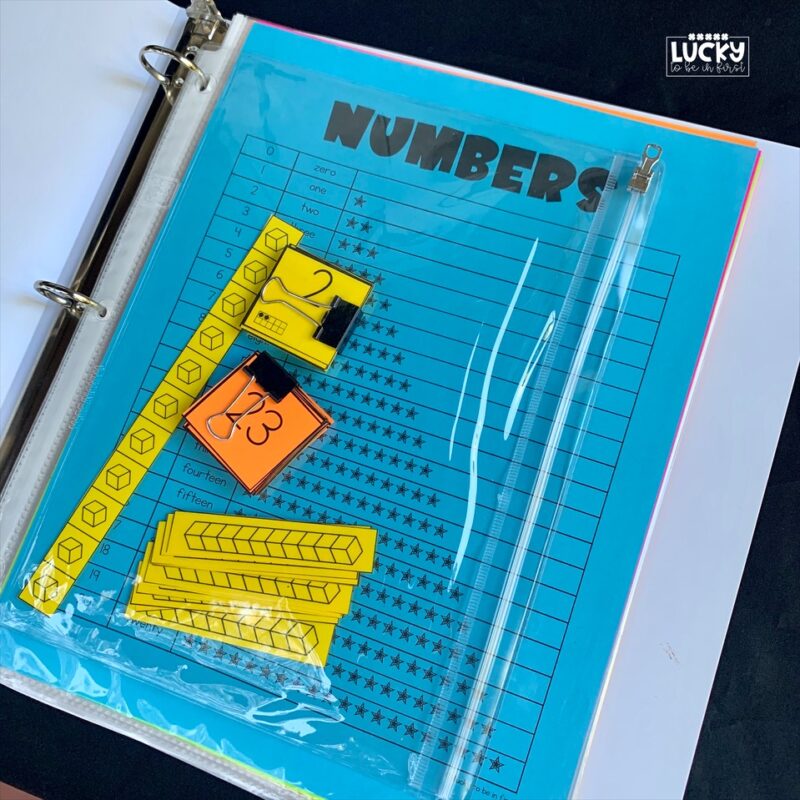 a finished math mat put into a binder with all necessary pieces | Lucky Learning with Molly Lynch