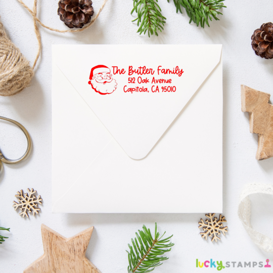 custom Santa Christmas Address Stamps on an envelope by Lucky stamps